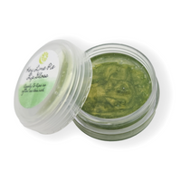 a small jar of green lip gloss