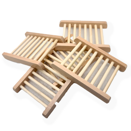 a series of stacked wooden ladder styled soap dishes