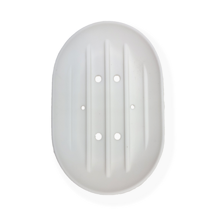 a small white, rounded plastic soap dish