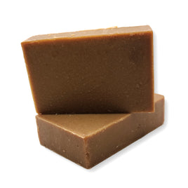 a stack of brown handmade soaps