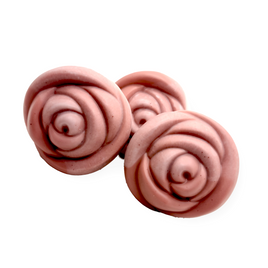 Three pink soaps designed to appear like roses