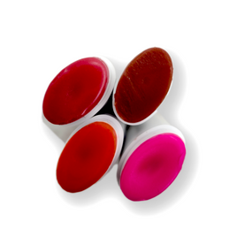 top viiew of strawberry colored lip balms in shades of red